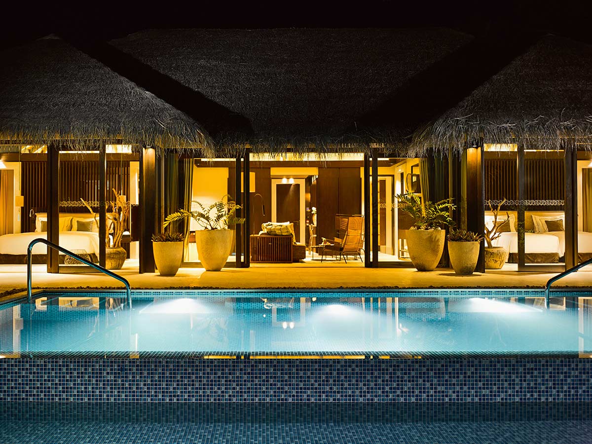 beach pool house at night